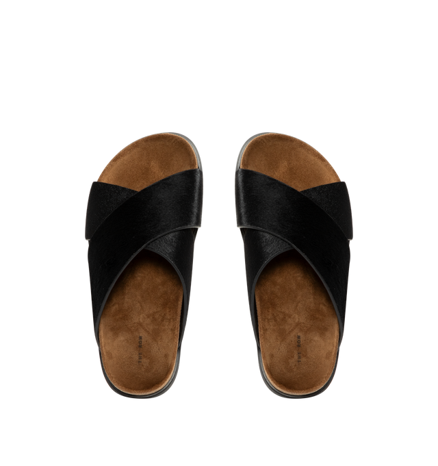 Image 4 of 4 - BLACK - The Row flat sandal in textured pony hair leather with wide overlapped upper straps, contoured cork footbed, and rubber sole. 100% Calfskin Leather. Made in Italy.