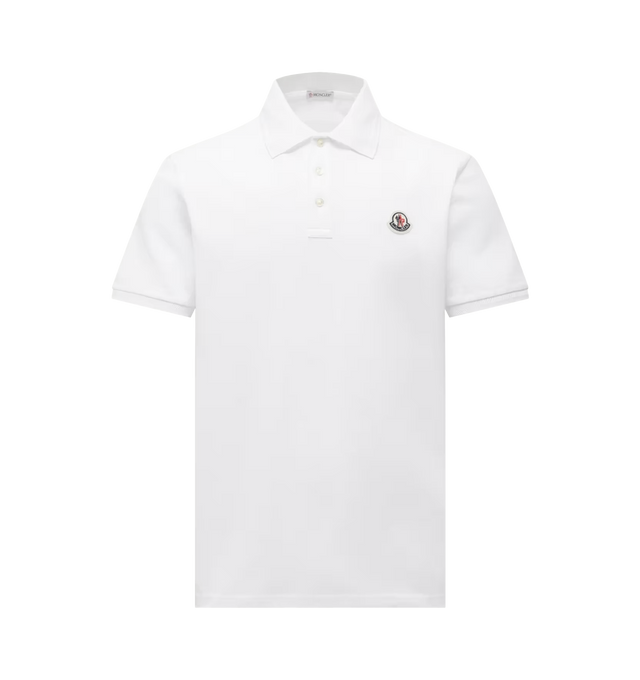 Image 1 of 1 - WHITE - Moncler Mens Cotton Polo Shirt is crafted from cotton piqu. Features a regular fit, ribbed collar with mother-of-pearl button closure, short sleeves, and signature logo patch. Main Material: 100% Cotton; Ribbed Cuffs: 99% Cotton, 1% Elastane/Spandex; Ribbed Collar: 99% Cotton, 1% Elastane/Spandex. Made in Turkey.