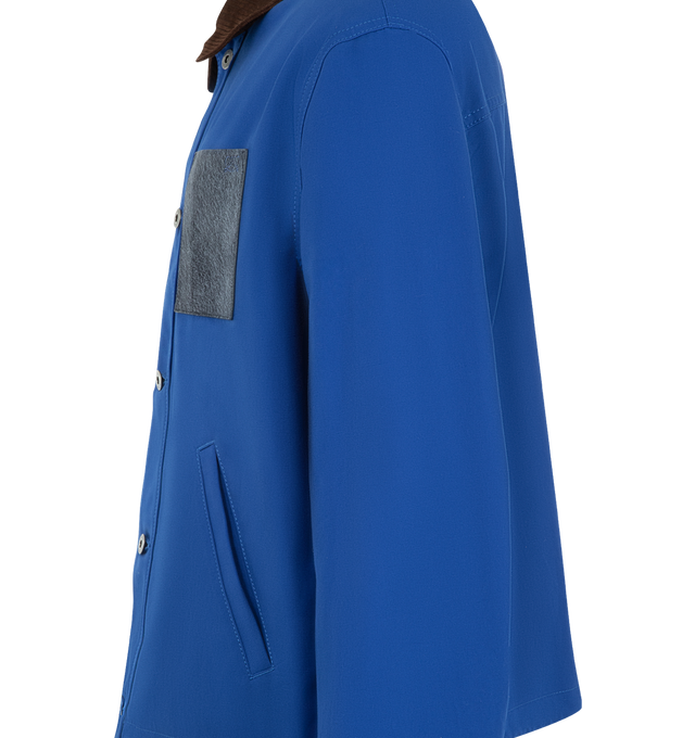 Image 3 of 3 - BLUE - LOEWE Workwear Jacket in lightweight cotton canvas featuring a corduroy-effect embossed suede classic collar, regular fit, regular length, button front fastening, front welt pockets, contrasting brushed suede chest patch pocket, contrasting corduroy-effect suede buttoned cuffs, drawstring hem and double L embroidery placed on the chest pocket. Cotton. Made in Italy.