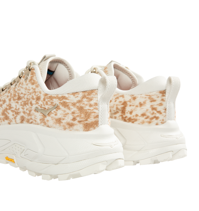 Image 3 of 5 - WHITE - HOKA Tor Summit+ Pony Hair Sneaker featuring pony hair leather upper, metal eyelets + hiking-style lacing system, Vibram Megagrip outsole for traction on varied terrain, cushioned midsole for long-wear comfort, pull tabs at heel and tongue for easy entry and ;ow-cut hiking silhouette.