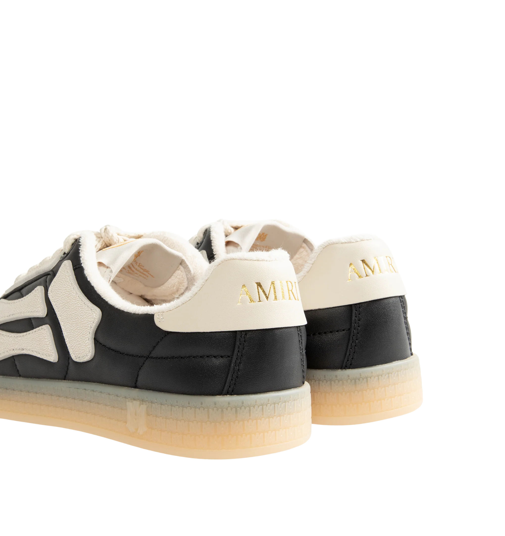 Image 3 of 5 - BLACK - Amiri Mens Pacific Football Sneakers are crafted with a leather upper and signature pebbled leather bone appliqus. Feature contrast topstitching, lace-up closure, padded collar, two-tone rubber sole, and low-top silhouette. Main Material: Leather Upper; Sole: Rubber. Made in Vietnam.
