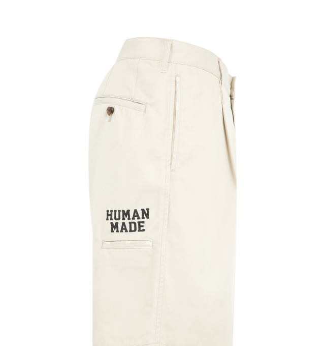Image 3 of 3 - WHITE - HUMAN MADE Skater Shorts featuring relaxed fit, lightweight polyester-cotton twill, two tucks on the front, zip fly with branded button, total of six pockets, brand logo above the right side pocket, heart button on the right back pocket and heart patch on the front left hem. 65% polyester, 35% cotton. Made in Japan..