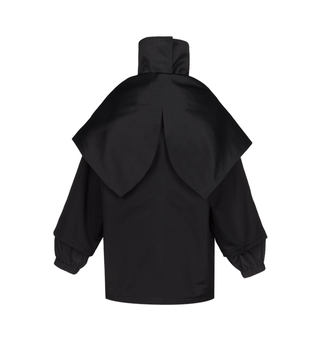 Image 3 of 3 - BLACK - Azzedine Alaa Womens Layered Parka is crafted from structured cotton canvas. Features a high neck, raglan sleeves, concealed placket, side seam pockets, back yoke, zipped hood, and back zipper that reveals a second layer underneath. Designed with a rounded shape and layered construction that can be worn as a traditional hooded jacket or fully opened and draped as a cape. Main Material: 88% Cotton; 32% Viscose, Secondary Material: 74% Polyamide, 26% Silk; Padding: 100% Polyester; Pocke