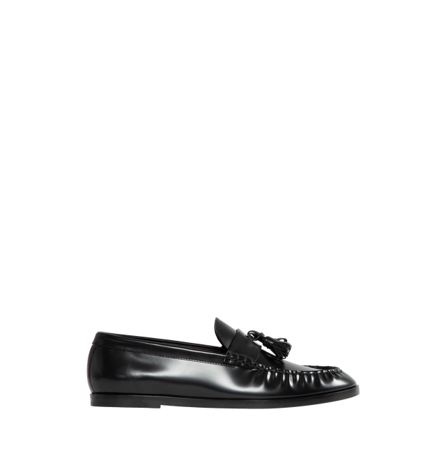 Image 1 of 4 - BLACK - THE ROW Loafer featuring sleek calfskin leather with natural pleating effect and tassel detailing. 100% leather. Made in Italy.