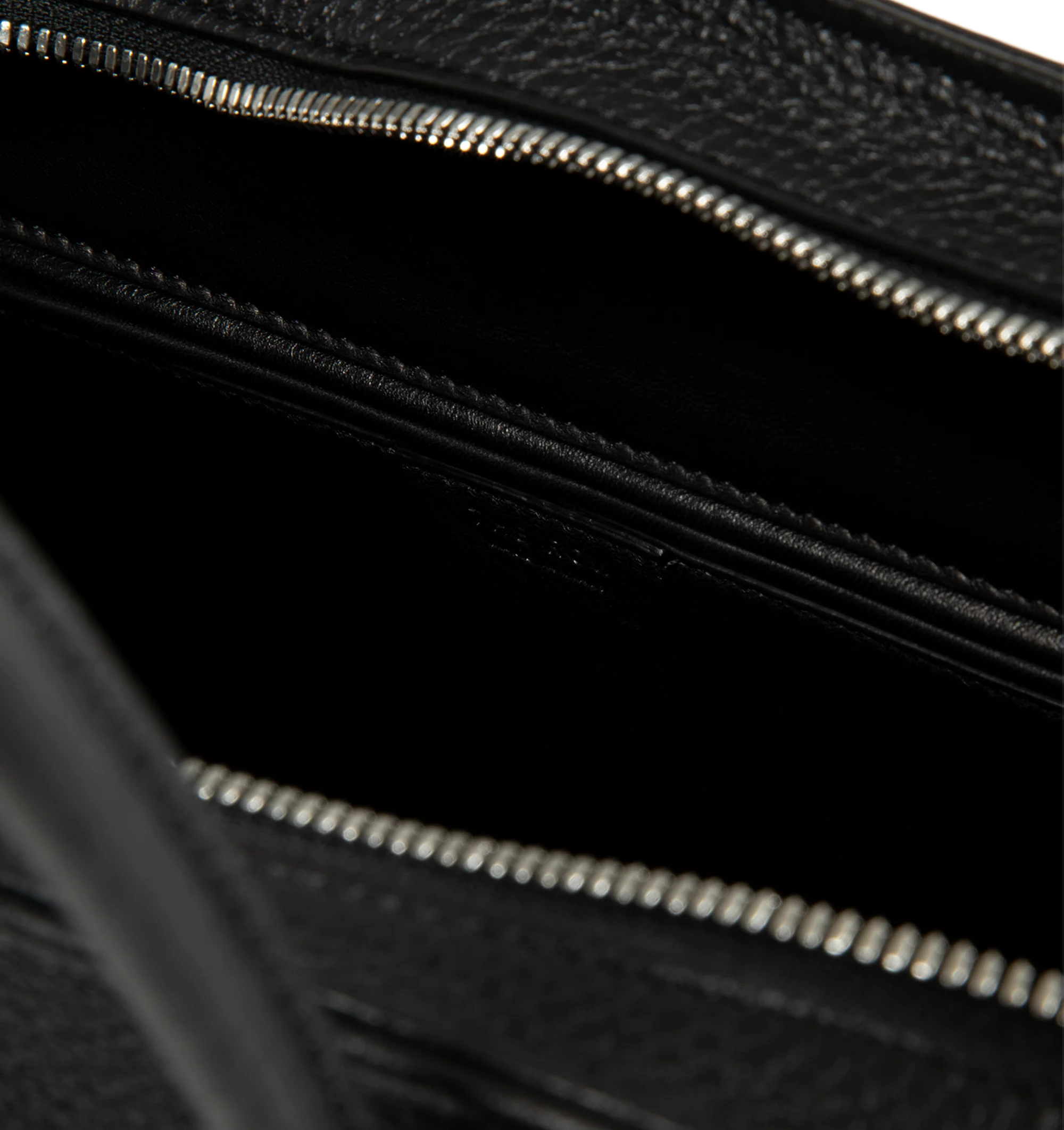 Image 4 of 4 - BLACK - The Row Agnes 15 Bag is crafted from finely grained calfskin leather and features a softly structured top-handle silhouette with tubular handles, gusseted side folds, a curved top zip closure, and a flat base. This designer leather handbag combines exceptional Italian craftsmanship with a spacious, minimalist design, while the naturally finished, metal-free tanned calfskin offers an exceptionally soft touch. Main Material: 100% Calfskin Leather. Lining: 100% Lambskin Leather. Dimensio