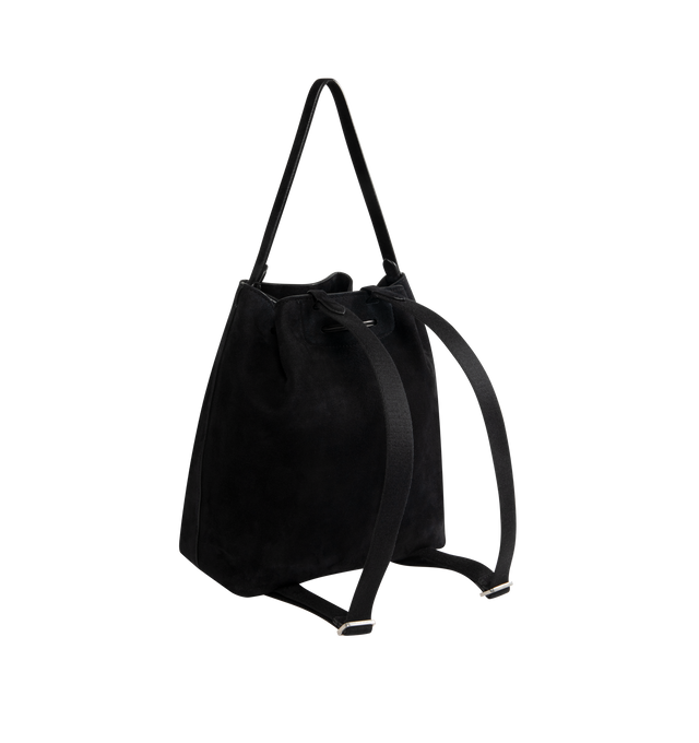 Image 3 of 4 - BLACK - THE ROW Backpack 9 in suede featuring a toggle fastening top, smooth leather trim, gold hardware, 2 adjustable, rivet fastening straps, 1 top handle, logo embossed purse feet at underside, single interior compartment with 1 slit pocket, key ring inside and suede lining. 10.5 W x 10.5 H. 100% calfskin leather. Made in Italy.