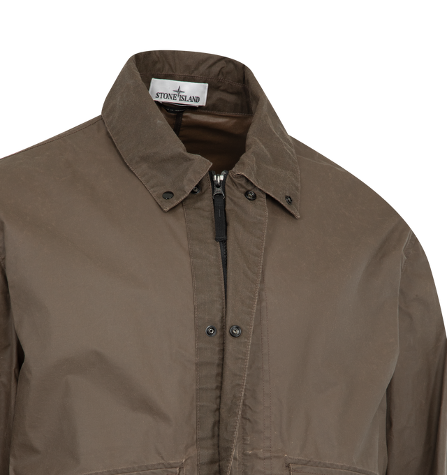 Image 4 of 4 - BROWN - STONE ISLAND Coach Jacket featuring collar with snap to wear standing, top-entry bellows hand pockets with flap and concealed snap, with overlapping angled pockets, eyelets under back armholes, Stone Island badge on left sleeve, adjustable cuffs with snap and two-way zipper fastening under snap placket. 65% polyester, 35% cotton.