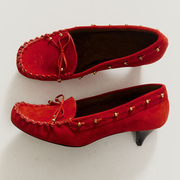 Pair of red kitten heel loafers with gold studs by Khaite
