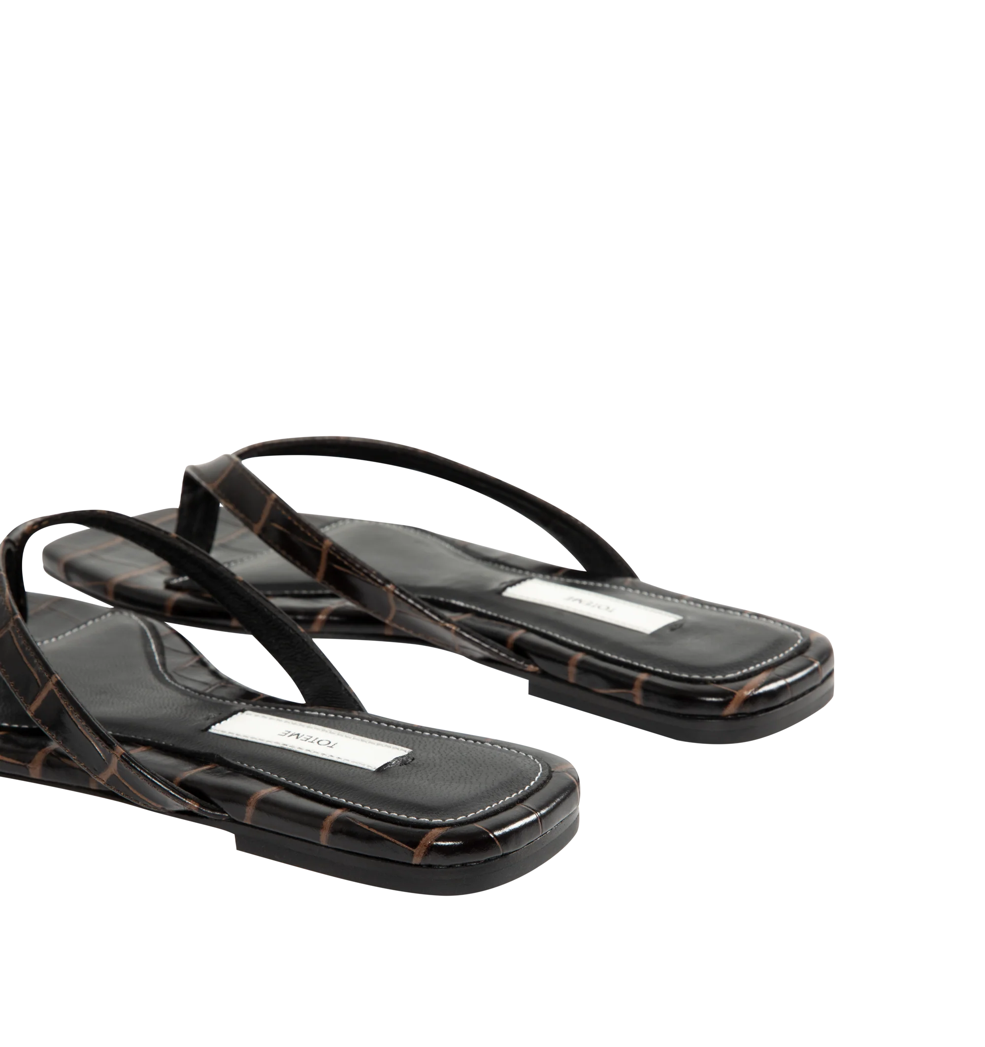 Image 3 of 4 - BROWN - Toteme Women's Croco-Embossed Flip-Flops are crafted from croc-embossed leather and feature a minimalist thong silhouette with an open square toe. Designed with a padded sheepskin footbed featuring a subtle logo patch, these designer sandals are finished with a calfskin leather sole for a refined take on an everyday warm-weather essential. Part of Toteme's Garderob collection. Upper: Leather. Footbed: Sheepskin. Sole: Calfskin Leather. Color: Dark Brown. Made in Italy.