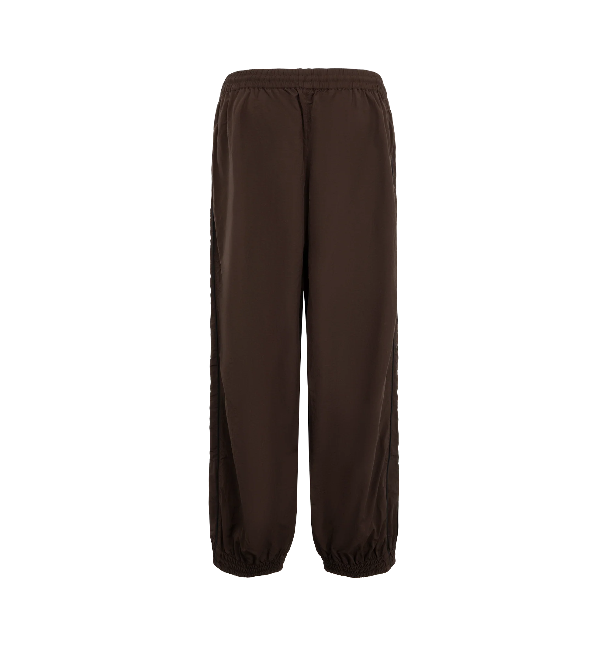 Image 2 of 3 - BROWN - Willy Chavarria Bad Boy Track Pant is crafted from lightweight nylon and features a relaxed athletic silhouette with an elasticated waistband and cuffs. Designed with a concealed drawstring waist, two seam pockets, embroidered logo detailing, and contrast piping along the outseams, the pant delivers the brand's bold sportswear-inspired aesthetic. Main Material: 100% Nylon.