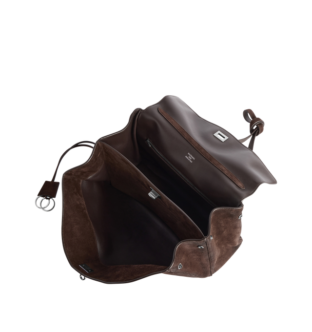 Image 4 of 4 - BROWN - BALENCIAGA Rodeo Handbag Medium in waxed suede calfskin and smooth calfskin featuring one handle, removable shoulder strap, removable cloche cls with two split rings, aged-silver hardware, turn lock closure, wide front pocket, 1 main compartment, 1 inner zipped pocket, 2 flat pockets at back, side snaps, 4 brass feet and nappa lambskin lining. L13.8 x H9.2 x W4.3 inch. Calfskin. Made in Italy.