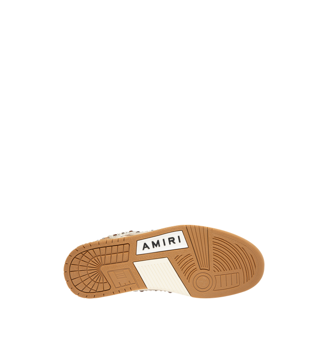 Image 4 of 5 - BROWN - AMIRI Stud Skel Top Low Sneaker featuring bone appliques, stud detailing, two-tone rubber sole with an upper paneled with washed denim and textured suede. 95% cotton, 5% polyester. Sole: rubber. 