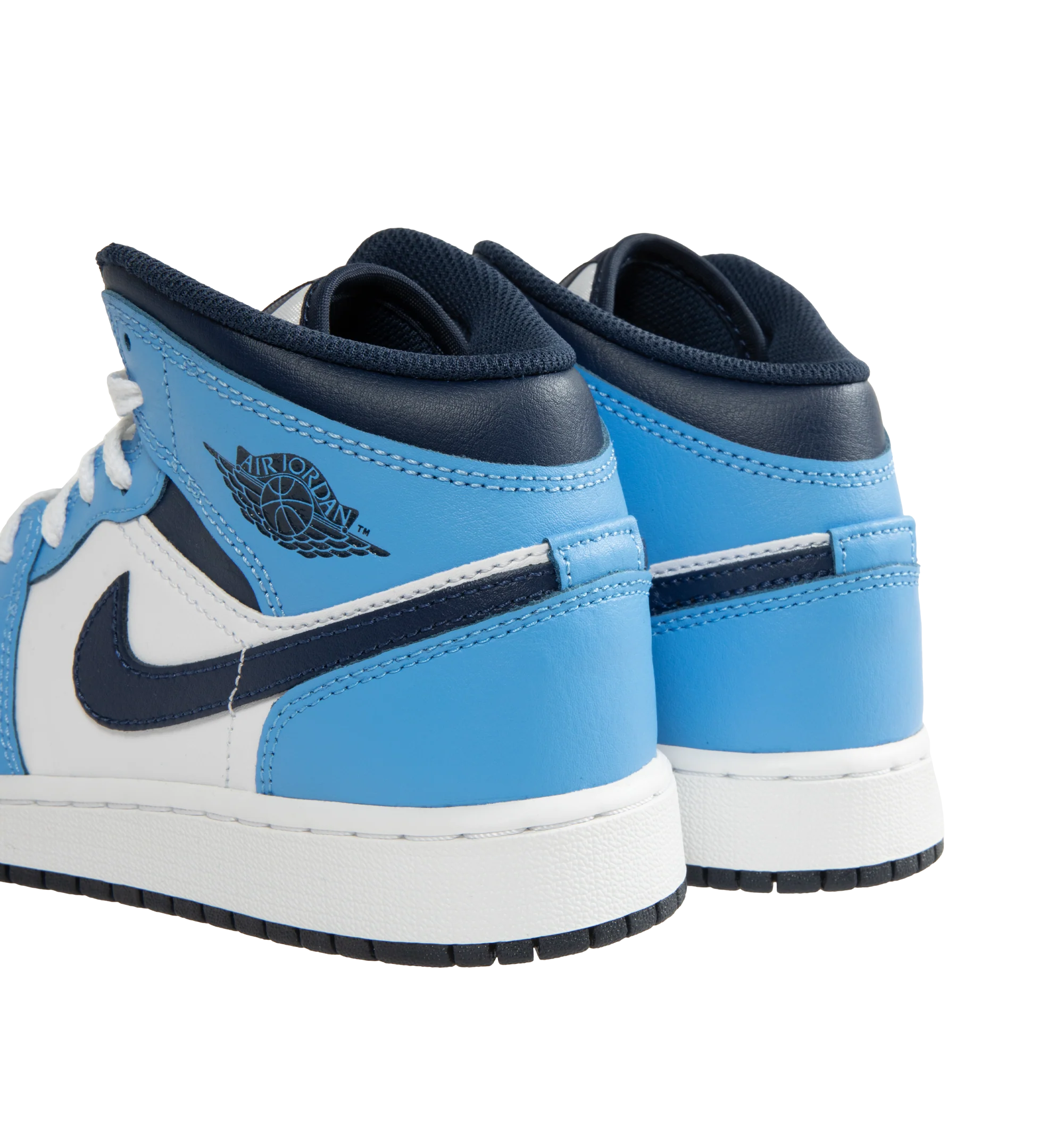 Image 3 of 5 - BLUE - Men's Air Jordan 1 Mid Sneakers feature a leather, synthetic leather, and textile upper with the iconic mid-top silhouette for a timeless heritage look. These lifestyle sneakers combine lightweight Nike Air cushioning, a foam midsole, and a durable rubber outsole with a pivot-circle traction pattern for lasting comfort, support, and reliable grip. Main Material: Leather, Synthetic Leather, and Textile. Midsole: Foam with Nike Air Cushioning. Sole: Rubber.