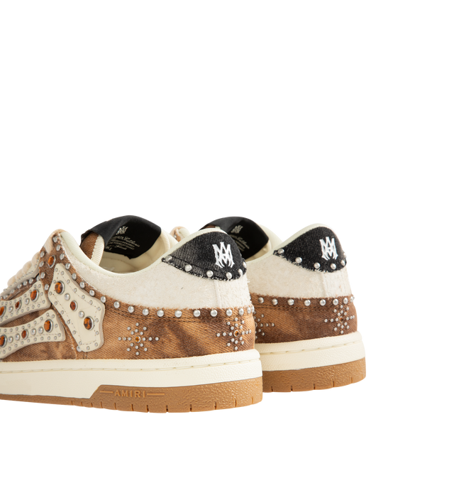 Image 3 of 5 - BROWN - AMIRI Stud Skel Top Low Sneaker featuring bone appliques, stud detailing, two-tone rubber sole with an upper paneled with washed denim and textured suede. 95% cotton, 5% polyester. Sole: rubber.