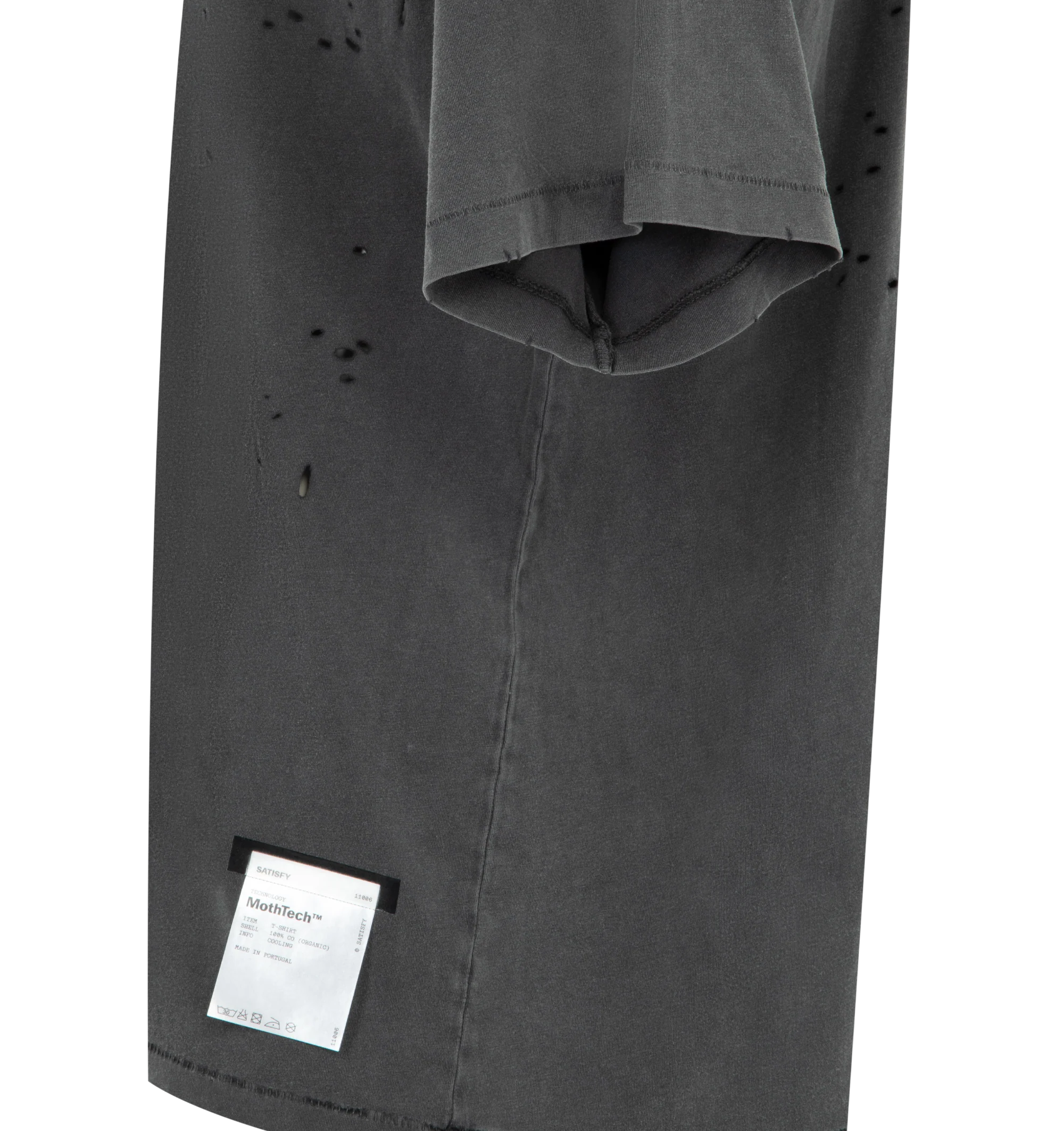 Image 3 of 3 - AGED BLACK SAB - SATISFY MothTech T-Shirt featuring short sleeves, crew neck, weathered with each hole that is laser-cut and hand-opened to creating airflow, logo in puffy ink, stealth-reflective SATISFY logo and fully detachable care label on the outside. 100% cotton.