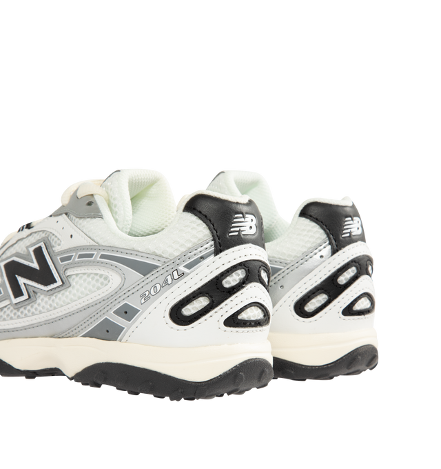 Image 3 of 5 - GREY - New Balance Mens 204L Sneakers feature a low-profile silhouette with a synthetic upper, embossed overlays, screen-printed saddle graphics, and double-stacked suede "N" logo. Designed with an EVA outsole and a distinctive tread pattern inspired by 2000s running shoes and 1970s heritage styles. Upper: Synthetic with Suede Details; Outsole: EVA. Made in Indonesia. 