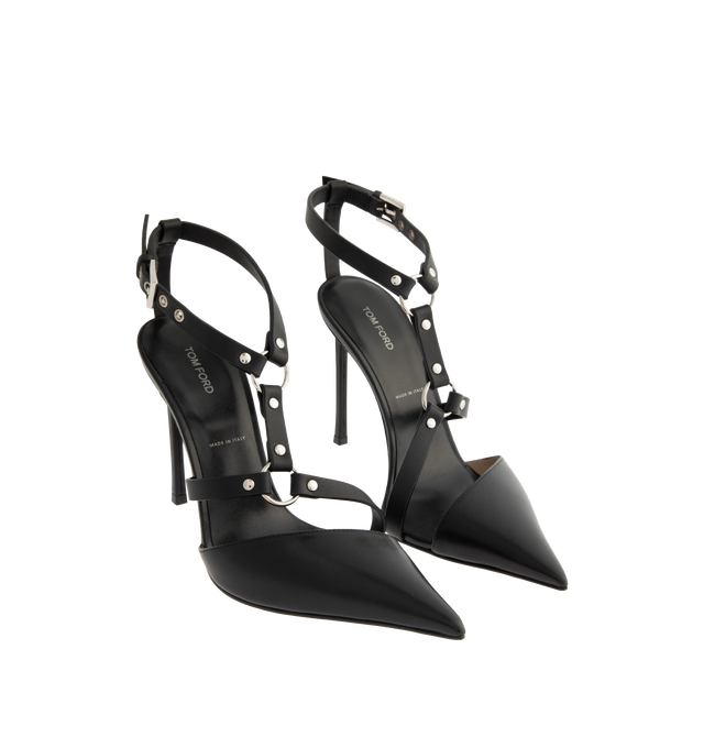 Image 2 of 4 - BLACK - TOM FORD Shiny Leather Bound Pump featuring a harness-inspired asymmetric design, silver-tone metal hardware, pointy toe, 105mm stiletto heel, adjustable ankle strap with a logo-engraved buckle and a nude leather lining and sole. 100% goatskin, straps in smooth leather 100% calfskin. Made in Italy.