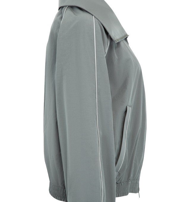 Image 3 of 3 - GREY - BALENCIAGA High Collar Tracksuit Jacket featuring techno cotton poplin, a long high stand up collar, double-ended zip fastening, dropped shoulders, reflective piping, 2 zipped slash pockets, gathered cuffs and waistline and reflective effect artwork printed on the chest. 50% cotton, 50% polyamide. Lining: 100% polyester. Made in Italy.