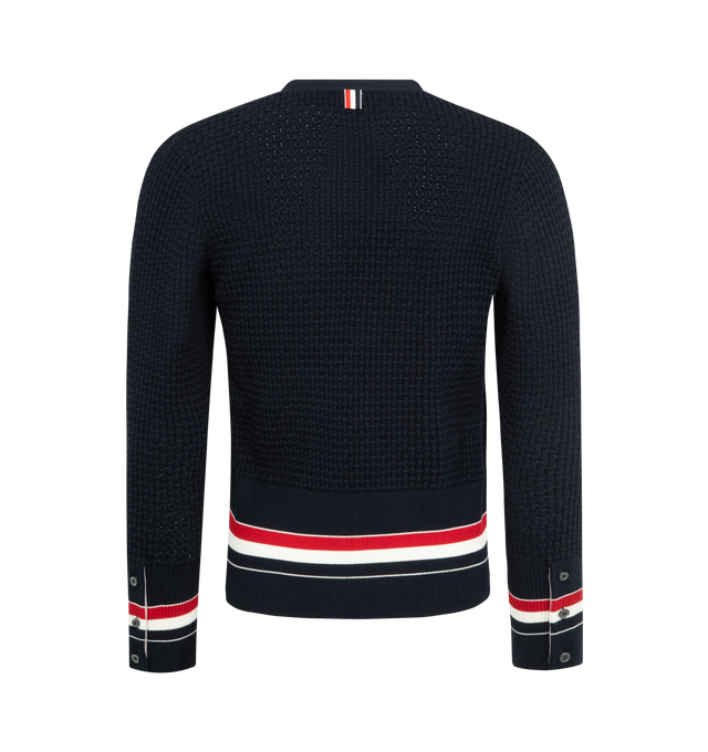 Image 2 of 3 - NAVY - THOM BROWNE Float Ripple Stitch Cardigan featuring high-twist cotton with a float ripple stitch, V neckline, front button closure with RWB grosgrain placket, patch hand pockets with ribbed trim, buttoned cuffs and side vents with RWB grosgrain trim, engineered RWB detailing and signature striped grosgrain loop tab. 100% cotton. Made in Italy.