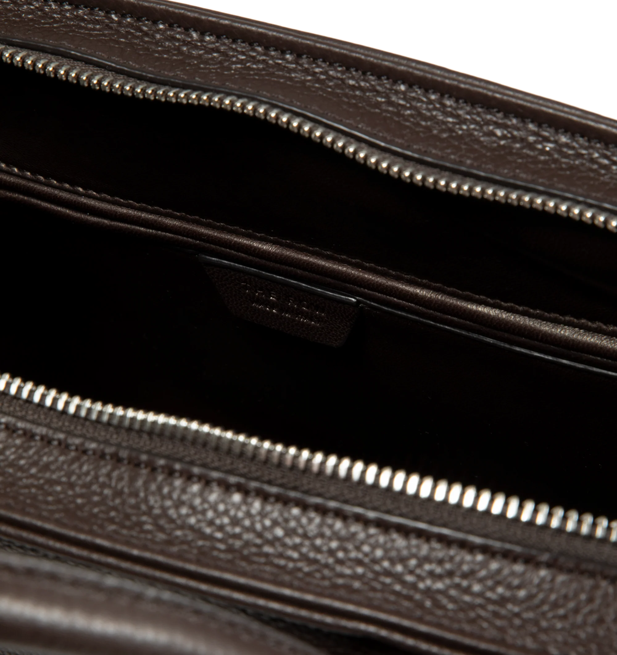 Image 4 of 4 - BROWN - The Row Agnes 12 Bag is crafted from finely grained calfskin leather and features a softly structured top-handle silhouette with tubular handles, gusseted side folds, a curved top zip closure, and a flat base. This designer leather handbag combines exceptional Italian craftsmanship with timeless minimalist design, offering a refined everyday carry with a spacious, elegant interior. Main Material: 100% Calfskin Leather. Lining: 100% Lambskin Leather. Dimensions: 12.99 x 5.91 x 8.27 in.