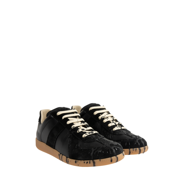 Image 2 of 5 - BLACK - MAISON MARGIELA High Quality Luxury Sneakers featuring a classic low-top silhouette, contrast of matte leather and a patent sprayed finish, paint splatter detail, lace-up construction and rubber sole. Made in Italy.