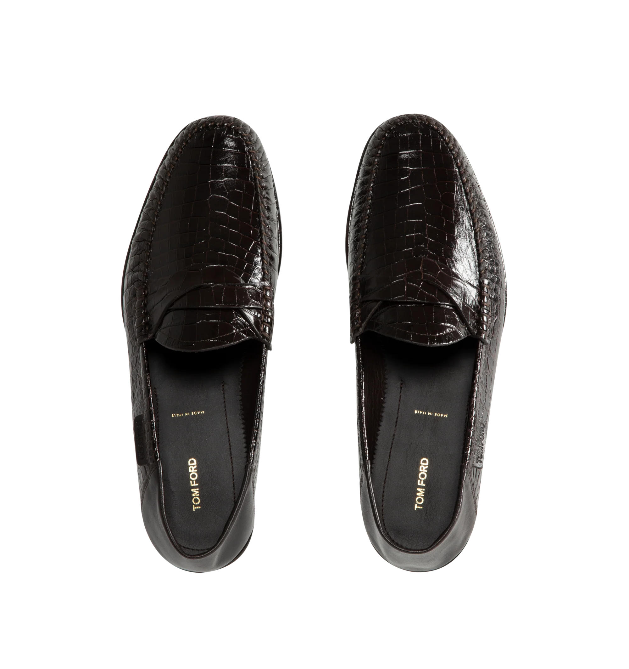 Image 5 of 5 - BROWN - Tom Ford Men's Soft Printed Alligator Sebastian Loafer is crafted from soft printed alligator-effect calf leather and features a distinctive twisted band detail. Designed as a soft loafer with a collapsible back, this versatile style can also be worn as a sabot. The refined silhouette is finished with a leather lining and a durable leather and rubber sole. Main Material: 100% Calf Leather. Lining: 75% Kid Leather, 25% Calf Leather. Sole: 70% Rubber, 30% Calf Leather. Made in Italy.