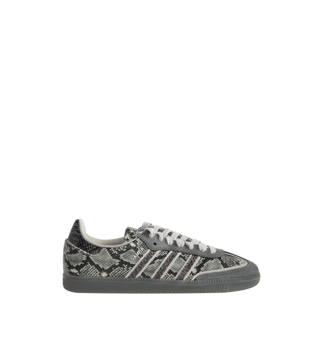 Image 1 of 5 - GREY - Adidas Men's Samba OG Snake-Effect Sneakers are crafted from calf leather. Features a snake-effect finish, round toe, lace-up closure, signature 3-Stripes, logo-print tongue, branded heel counter, and flat rubber sole. Upper: Calf Leather; Lining: Calf Leather; Sole: Rubber. Made in Vietnam.
