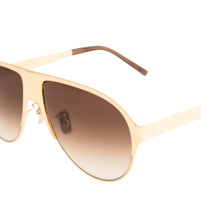 Image 3 of 3 - GOLD - GIVENCHY Metal Sunglasses featuring GIVENCHY bold line, pilot shape, brown with silver flash lenses, adjustable nose pads and GIVENCHY signature engraved on the temples. 100% UVA/UVB protection. 100% metal. Made in Italy.