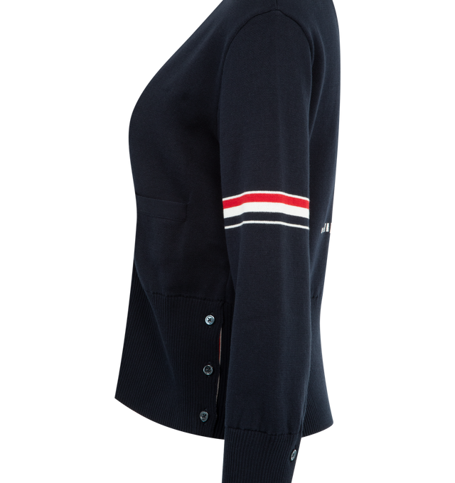 Image 3 of 3 - NAVY - THOM BROWNE Jacquard Sailboat Cardigan featuring V-neckline with striped trim, front button closure, welt hand pockets with ribbed trim, RWB intarsia armbands, ribbed buttoned cuffs and side vents with internal RWB grosgrain trim, ribbed hem, sailboat intarsia on back and signature striped grosgrain loop tab. 100% cotton. Made in Italy. 