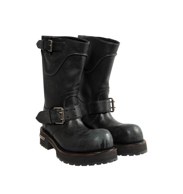 Image 2 of 4 - BLACK - BALENCIAGA Venom Boot featuring extra round toe, 20 mm arch, worn-out effect, adjustable straps with belt buckles, Balenciaga and 10 AV George V 75008 Paris logo debossed on the upper, plate with Balenciaga logo engraved on exterior outsole and thick toothed rubber outsole. Calfskin. Sole: micro, TPU, calfskin, zamac. Made in Italy.