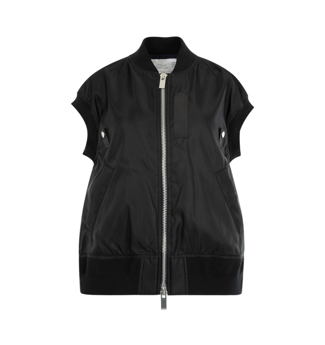Image 1 of 2 - BLACK - SACAI Nylon Twill Vest featuring rib-knit stand collar, hem, and armscyes, two-way zip closure, webbing trim and press-stud tabs at front, welt pockets, inverted box pleat at back yoke and full satin lining. 100% nylon. Fill: 100% polyester. Lining: 100% cupro. Made in Japan.