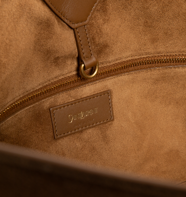 Image 3 of 3 - BROWN - SAINT LAURENT Y Small Tote in suede featuring small version of the Y tote in finely grained leather, ultra-lightweight bag, subtle Y signature stitching, lined in tonal leather, zip pocket, hook closure, one zip pocket and one keyring carabiner tab. 11.4" x 9.4" x 6.5". Calfskin. Made in Italy.
