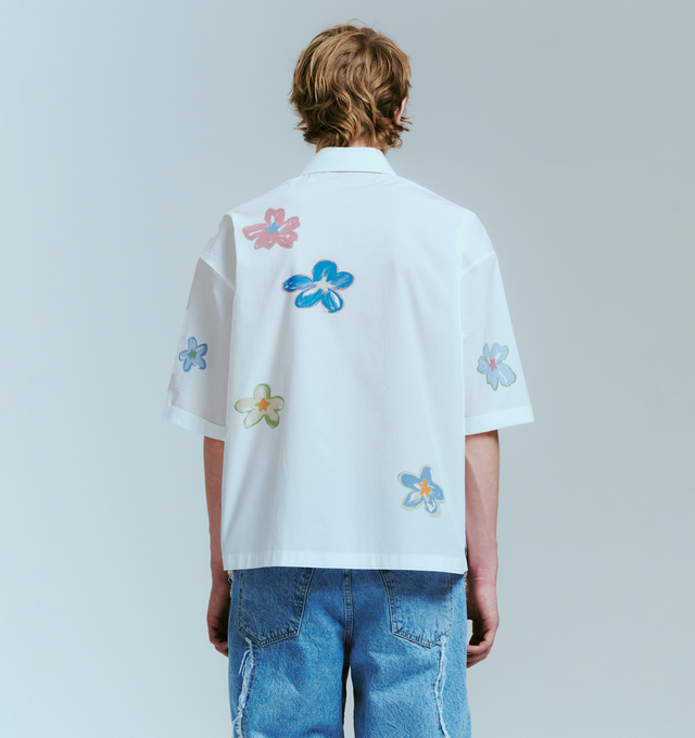 Image 4 of 4 - WHITE - NAHMIAS Super Bloom Cropped Shirt featuring front button closure, single chest pocket, midweight poplin fabric, spread collar and placed super bloom graphic. 100% cotton. 