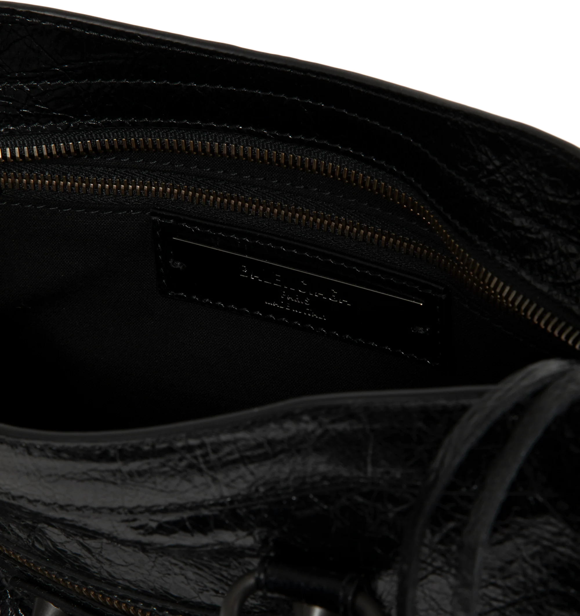 Image 3 of 3 - BLACK - Balenciaga Women's Le City Small Bag is crafted from supple leather and features the house's iconic slouchy silhouette with rolled top handles, signature buckle detailing, and an adjustable, detachable shoulder strap for versatile styling. Designed with a spacious zip-top main compartment, this designer handbag blends Balenciaga's archival motorcycle-inspired aesthetic with everyday functionality. Main Material: Leather. Dimensions: 30 x 19 x 10 cm. Made in Italy.