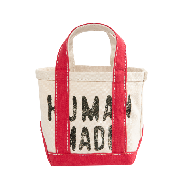 Image 1 of 3 - WHITE - HUMAN MADE Small Canvas Tote Bag featuring fleece-tough cotton canvas, wash finish creating a textured wrinkled look, seeped-in graphic, contrasting color accents on the handles and bottom, heart-shaped rivets on the side seams and external pocket attached to the side with the heart logo. 100% cotton.