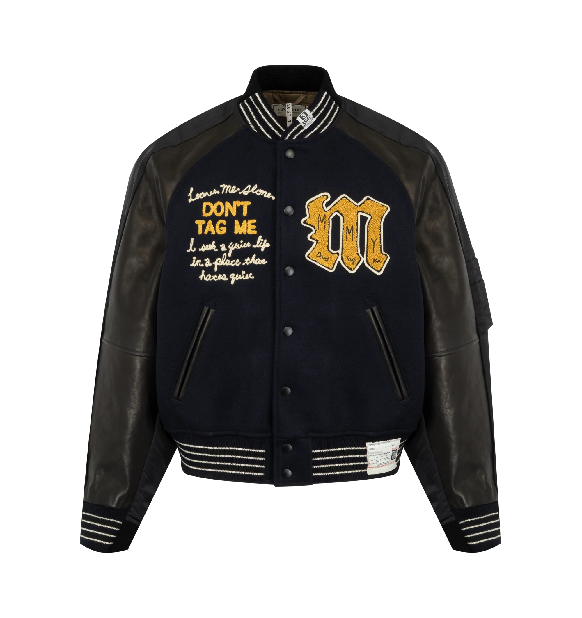Image 1 of 3 - BLACK - Maison Mihara Yasuhiro Men's Combined Stadium Bomber Jacket is crafted from a premium mixed-material construction and features a hybrid stadium and bomber silhouette with ribbed trim, a front button closure, and side pockets for a contemporary layered look. This designer jacket combines classic varsity-inspired elements with Maison Mihara Yasuhiro's signature deconstructed aesthetic, creating a bold statement piece for everyday wear. Main Material: Mixed Materials. Made in Japan.
