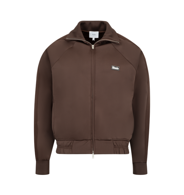 Image 1 of 3 - BROWN - RHUDE Madera Track Jacket featuring funnel neck, long sleeves, 2-way zip, 2 waist welt pockets and regular fit. 100% polyester.