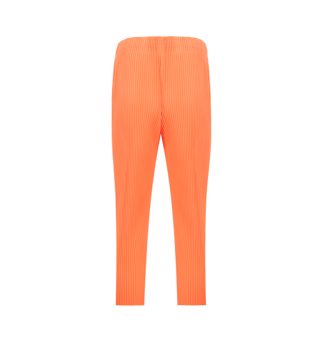 Image 2 of 3 - ORANGE - ISSEY MIYAKE Pant featuring portability and lightweight comfort, quick-drying properties, shorter length, pockets on both sides, a drawstring waist and button-fly design. 100% polyester. Made in Japan.