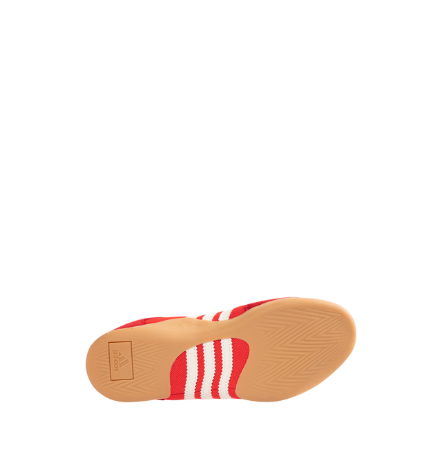 Image 4 of 5 - RED - Adidas Mens Originals x Bad Bunny Ballerina Sneakers are crafted from canvas and suede. Features a low-cut silhouette, lace-up closure with bungee-cord laces, signature 3-Stripes, "Benito" branding, adidas para Bad Bunny detailing, heel pull tab, textile lining, and gum rubber outsole. Upper: Canvas and Suede; Lining: Textile; Outsole: Rubber. Made in Vietnam.