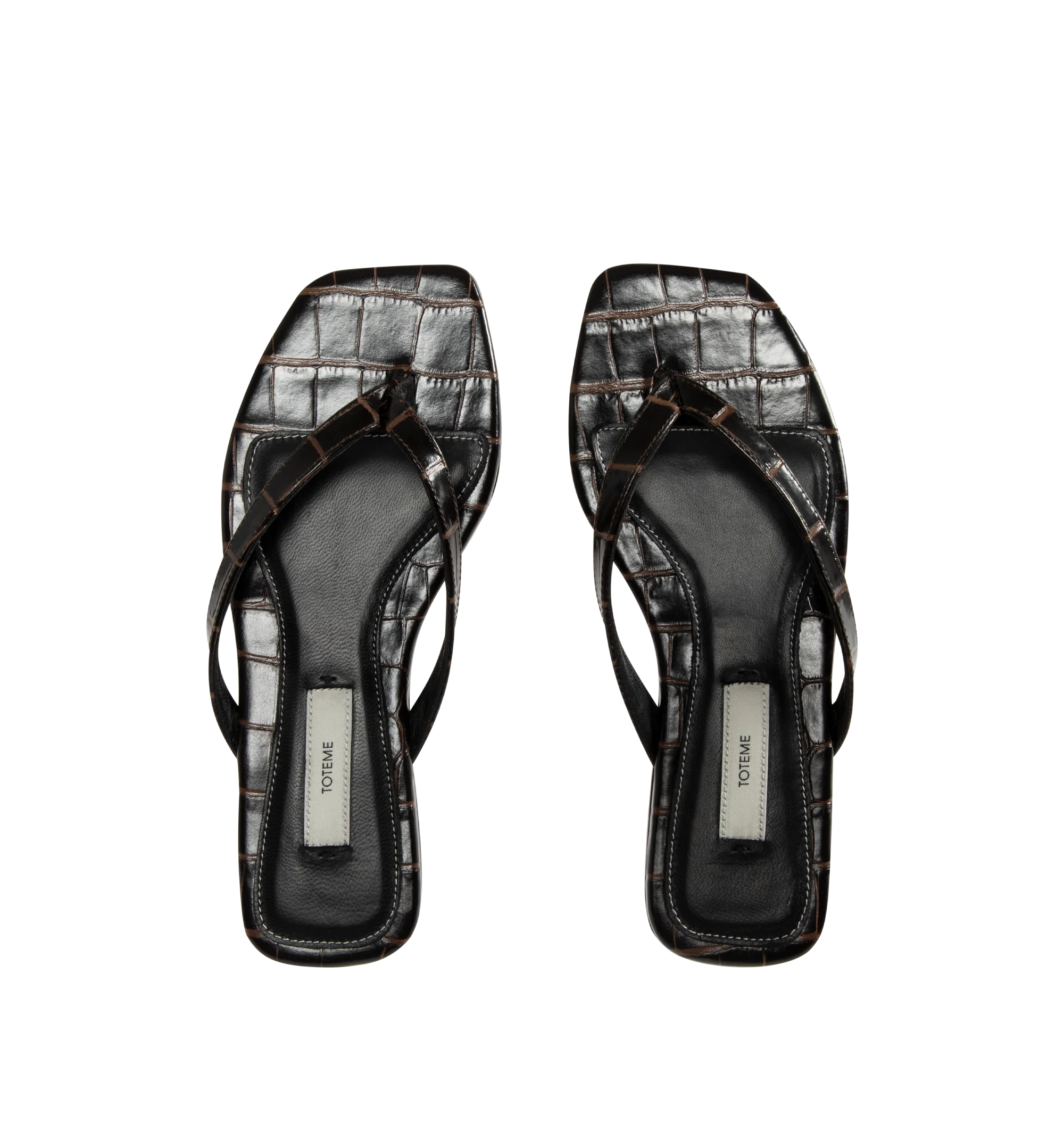 Image 4 of 4 - BROWN - Toteme Women's Croco-Embossed Flip-Flops are crafted from croc-embossed leather and feature a minimalist thong silhouette with an open square toe. Designed with a padded sheepskin footbed featuring a subtle logo patch, these designer sandals are finished with a calfskin leather sole for a refined take on an everyday warm-weather essential. Part of Toteme's Garderob collection. Upper: Leather. Footbed: Sheepskin. Sole: Calfskin Leather. Color: Dark Brown. Made in Italy. 