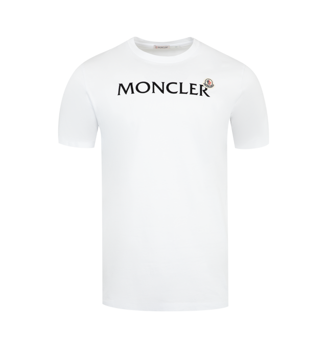 Image 1 of 2 - WHITE - MONCLER Logo Tee featuring GOTS-certified cotton jersey, short sleeves, flocked logo print and logo patch. 100% cotton.