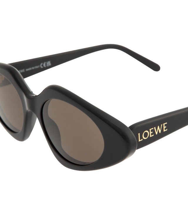 Image 3 of 3 - BLACK - LOEWE Triangle Slim Sunglasses featuring triangle-shaped sunglasses in a slim acetate construction, international fit, UVA/UVB protection and gold-finish metal LOEWE. Acetate. Made in Italy.