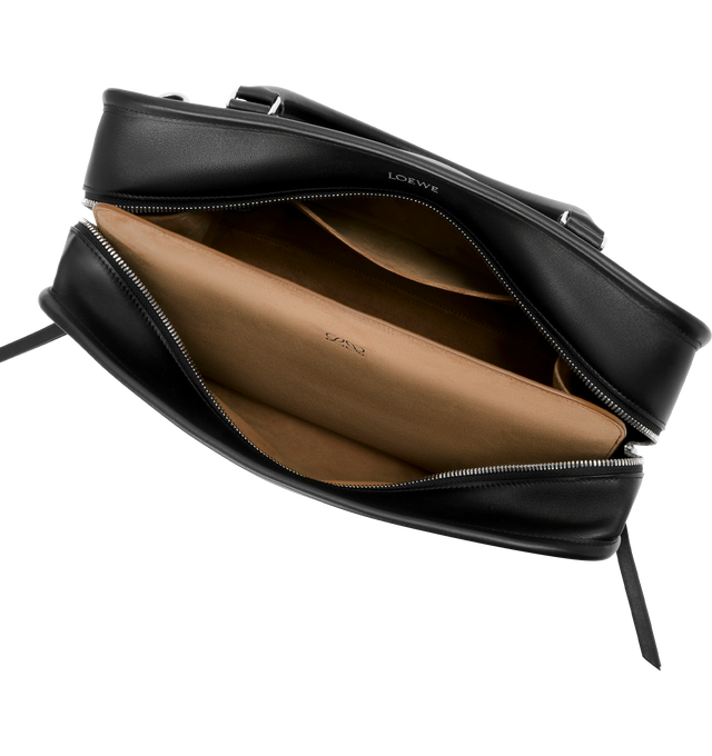Image 12 of 16 - BLACK - Loewe Amazona 180 large bag takes on a relaxed silhouette anchored by a single toron top handle. It is designed to be carried open, while a concealed closure secures the main compartment. Removable shoulder and crossbody straps make it highly versatile. This large version is crafted in soft calfskin. Three carry options: short handle, removable shoulder strap and crossbody. Features zip closure with two leather zip pullers, two compartments, main compartment closed with magnetic clo