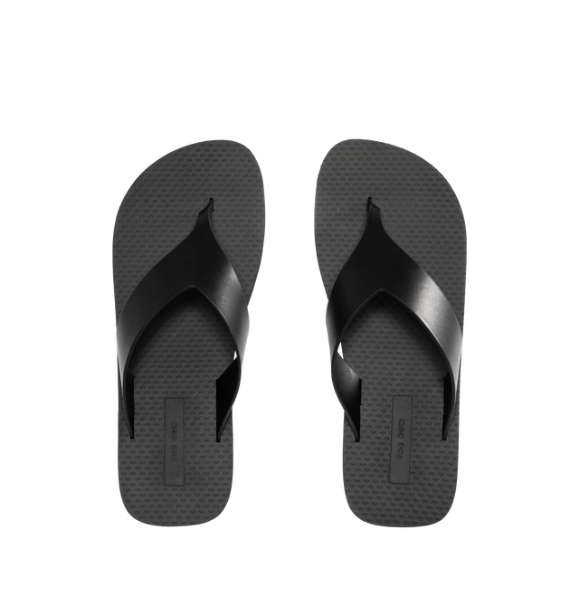 Image 4 of 4 - BLACK - THE ROW Dune Classic Ginza Sandal featuring modern flip flop sandal in sleek calfskin leather with seamless contoured strap, textured footbed, and lightly treaded rubber sole. 100% calfskin leather. Made in Italy. 