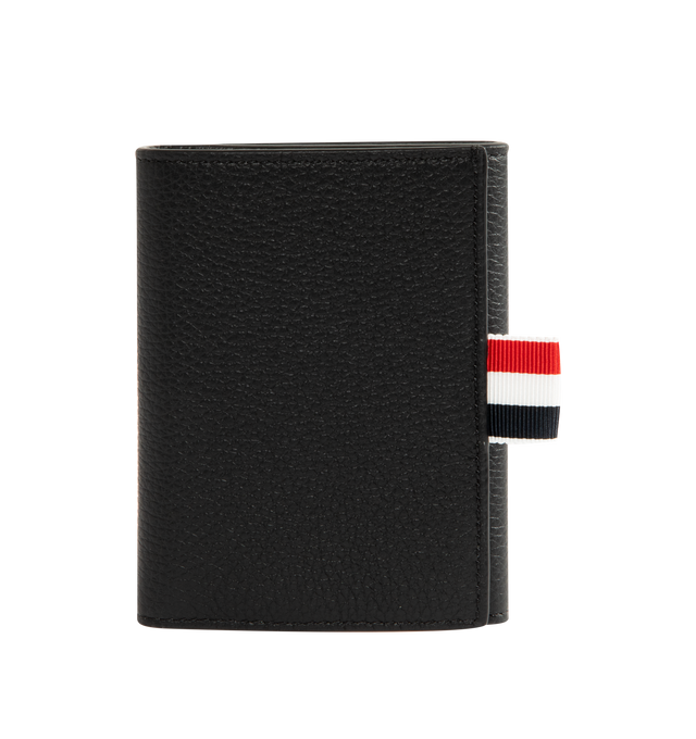 Image 1 of 3 - BLACK - THOM BROWNE Soft Pebble Grain Trifold Wallet featuring tricolor grosgrain flag at face, press-stud closure, four card slots, three patch pockets, one note slot, embossed logo at interior and Moir and tricolor grosgrain lining. H3.5" x W4.25". Leather. Made in Italy.