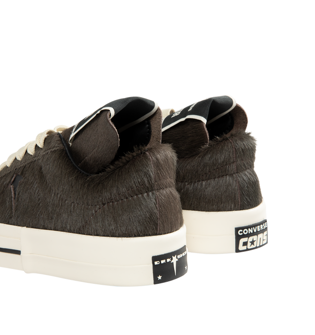Image 3 of 5 - BLACK - DRKSHDW X CONVERSE Calf Hair Low-Top Sneakers featuring an extra-textured hair-on-hide leather upper with exaggerated width proportions, flat heel, round toe, lace-up vamp, signature DRKSHDW elongated tongue with woven label, custom DRKSHDW Star logo on the side, skateboard One-Star Converse sole, DRKSHDW license plate with pentagram collab logo on the left heel, Converse All-Star logo on the right heel and CX foam cushioned internal midsole.