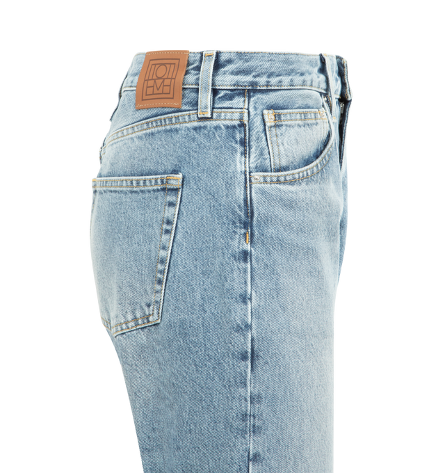Image 3 of 3 - BLUE - TOTEME Twisted Seam Denim featuring directional side seams, ankle-length, relaxed, straight-tapered shape, zipper fly, silver-tone hardware, five pockets, belt loops, finished hem and leather patch. 100% organic cotton.