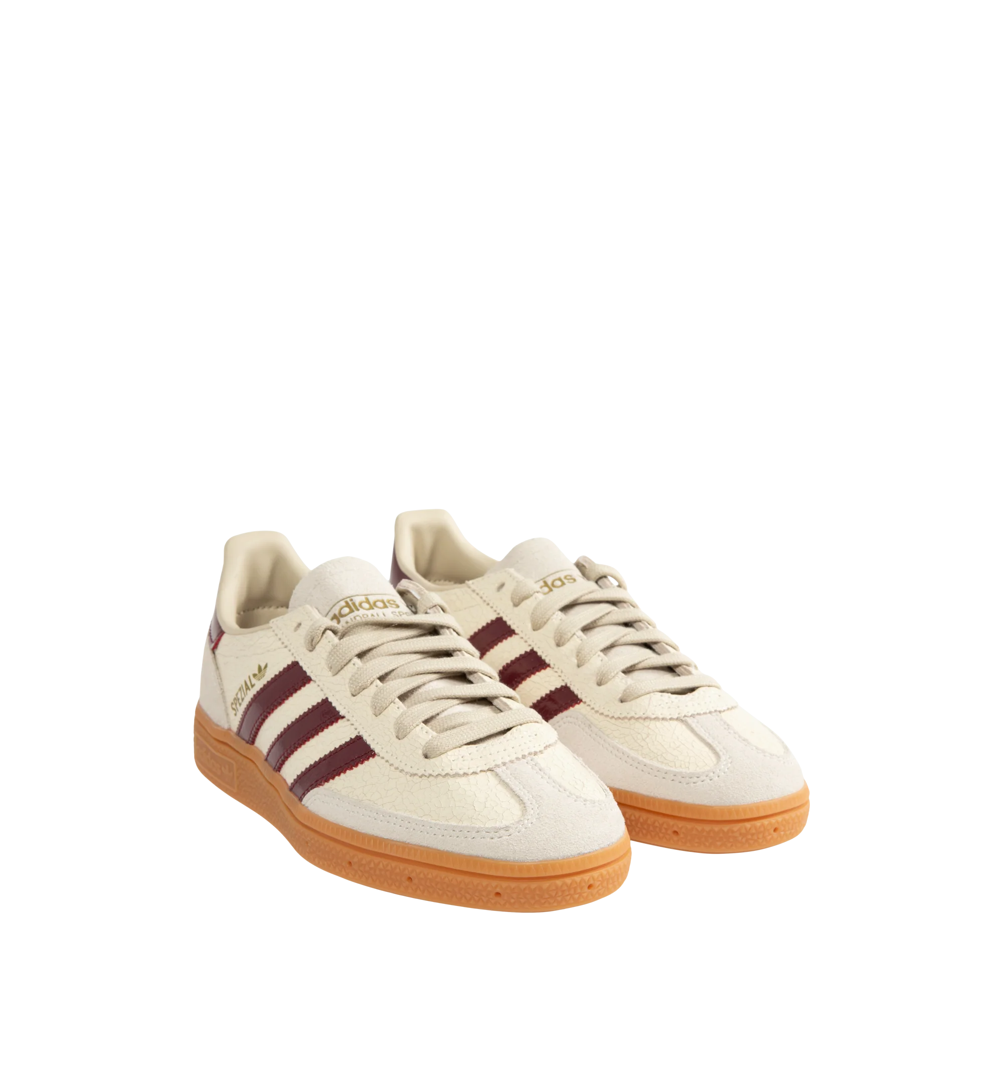 Image 2 of 5 - NEUTRAL - Adidas Men's Handball Spezial Sneakers feature a textured mix of cracked leather, suede overlays, and patent leather 3-Stripes. Designed in a regular fit with a secure lace-up closure, these designer sneakers feature signature Spezial detailing at the quarter and tongue and a soft gum rubber outsole. Upper: Leather. Lining and Insole: Textile and Other Materials. Outsole: Other Materials.