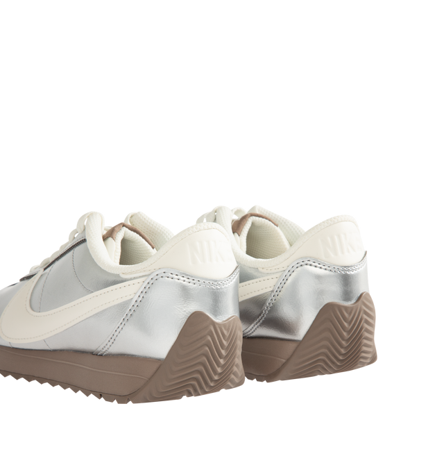 Image 3 of 5 - SILVER - NIKE Pacific Sneaker featuring synthetic leather upper with a metallic finish, wide collar opening, herringbone gum sole with flex grooves, puffed Swoosh logo and foam midsole.