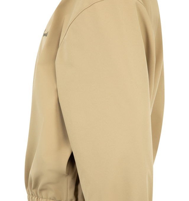 Image 3 of 3 - BROWN - FEAR OF GOD ESSENTIALS Signature Full Zip Track Jacket featuring stretch nylon taffeta, rib-knit stand collar, zip closure, logo embroidered at chest, seam pockets at waist, elasticized hem and cuffs, rubberized logo patch at back collar and full mesh lining. 90% nylon, 10% spandex. 